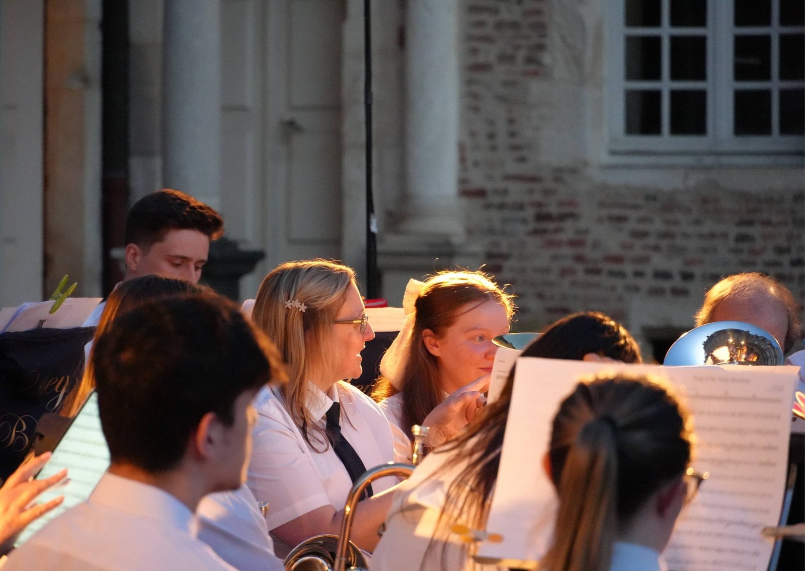 Valley Brass Band performing an outdoor concert at dusk